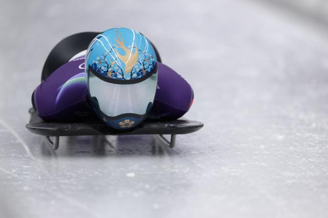 (260213) -- CORTINA D'AMPEZZO, Feb. 13, 2026 (Xinhua) -- Zhao Dan of China competes during the skeleton women competition heat 1 at the Milan-Cortina 2026 Olympic Winter Games in Cortina, Italy, Feb. 13, 2026. (Xinhua/Ding Xu)