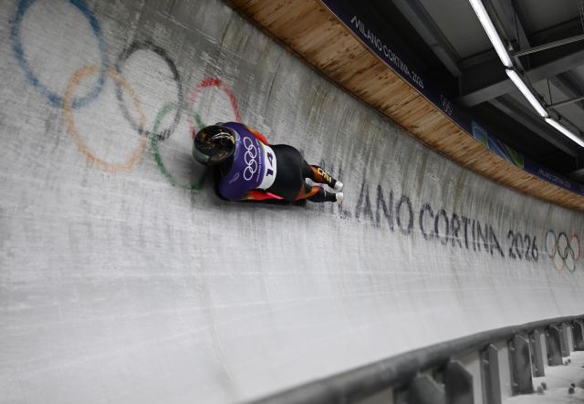 (260213) -- CORTINA D'AMPEZZO, Feb. 13, 2026 (Xinhua) -- Lin Qinwei of China competes during the skeleton men competition heat 3 at the Milan-Cortina 2026 Olympic Winter Games in Cortina, Italy, Feb. 13, 2026. (Xinhua/Lian Yi)