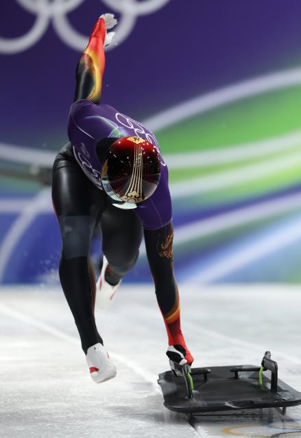 (260213) -- CORTINA D'AMPEZZO, Feb. 13, 2026 (Xinhua) -- Chen Wenhao of China competes during the skeleton men competition heat 3 at the Milan-Cortina 2026 Olympic Winter Games in Cortina, Italy, Feb. 13, 2026. (Xinhua/Ding Xu)