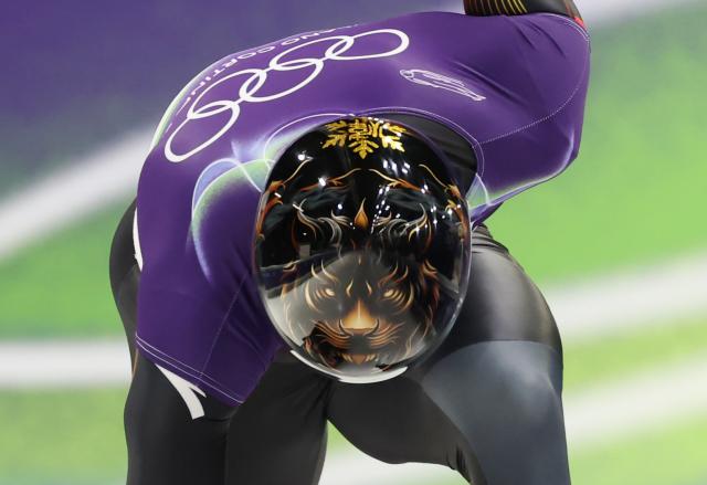 (260213) -- CORTINA D'AMPEZZO, Feb. 13, 2026 (Xinhua) -- Lin Qinwei of China competes during the skeleton men competition heat 3 at the Milan-Cortina 2026 Olympic Winter Games in Cortina, Italy, Feb. 13, 2026. (Xinhua/Ding Xu)