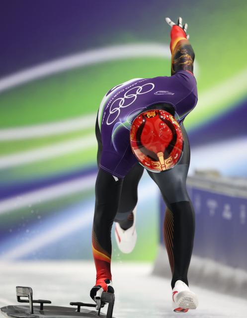 (260213) -- CORTINA D'AMPEZZO, Feb. 13, 2026 (Xinhua) -- Yin Zheng of China competes during the skeleton men competition heat 3 at the Milan-Cortina 2026 Olympic Winter Games in Cortina, Italy, Feb. 13, 2026. (Xinhua/Ding Xu)