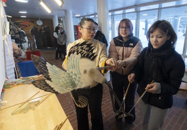 (260213) -- HELSINKI, Feb. 13, 2026 (Xinhua) -- Students try out an intangible cultural heritage shadow puppetry during a "Happy Chinese New Year" campus event at Kulosaari Secondary School in Helsinki, Finland, Feb. 13, 2026. A lively "Happy Chinese New Year" campus event was held at Kulosaari Secondary School in Helsinki on Friday. (Photo by Matti Matikainen/Xinhua)