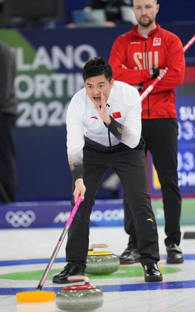 (260213) -- CORTINA D'AMPEZZO, Feb. 13, 2026 (Xinhua) -- Xu Xiaoming of China competes during the curling men round robin session 4 match between China and Switzerland at the 2026 Milan-Cortina Winter Olympics in Cortina, Italy, Feb. 13, 2026. (Xinhua/Li Gang)