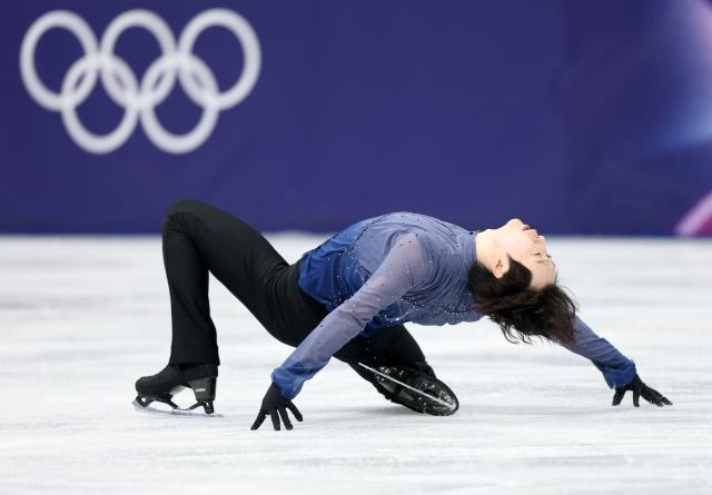 (260213) -- MILAN, Feb. 13, 2026 (Xinhua) -- Jin Boyang of China competes during the free skating of the men single skating match for figure skating event at the Milan-Cortina 2026 Olympic Winter Games in Milan, Italy, Feb. 13, 2026. (Xinhua/Li Ming)