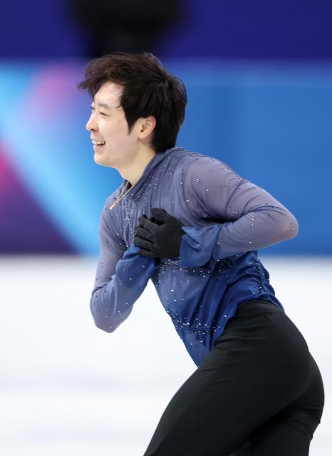 (260213) -- MILAN, Feb. 13, 2026 (Xinhua) -- Jin Boyang of China competes during the free skating of the men single skating match for figure skating event at the Milan-Cortina 2026 Olympic Winter Games in Milan, Italy, Feb. 13, 2026. (Xinhua/Li Ming)