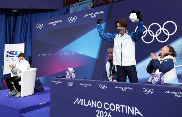 (260213) -- MILAN, Feb. 13, 2026 (Xinhua) -- Mikhail Shaidorov (top) of Kazakhstan celebrates during the free skating of the men single skating match for figure skating event at the Milan-Cortina 2026 Olympic Winter Games in Milan, Italy, Feb. 13, 2026. (Xinhua/Li Ming)