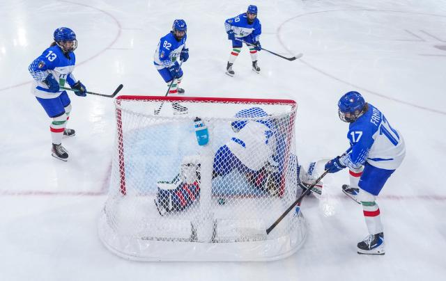 (260214) -- MILAN, Feb. 14, 2026 (Xinhua) -- Gabriella Durante, goalkeeper of Italy, fails to save a goal during the ice hockey women's play-offs quarterfinal match between the United States and Italy at the Milan-Cortina 2026 Olympic Winter Games in Milan, Italy, Feb. 13, 2026. (Xinhua/Sun Fei)