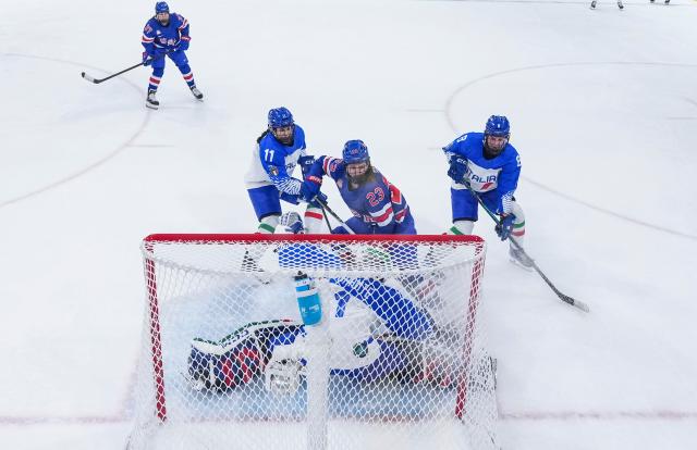 (260214) -- MILAN, Feb. 14, 2026 (Xinhua) -- Hannah Bilka (C) of the United States scores a goal during the ice hockey women's play-offs quarterfinal match between the United States and Italy at the Milan-Cortina 2026 Olympic Winter Games in Milan, Italy, Feb. 13, 2026. (Xinhua/Sun Fei)
