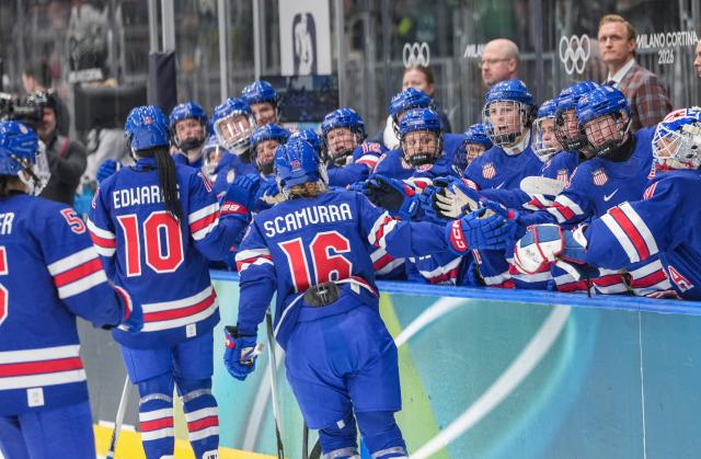(260214) -- MILAN, Feb. 14, 2026 (Xinhua) -- Hayley Scamurra (C) of the United States claps with her teammates during the ice hockey women's play-offs quarterfinal match between the United States and Italy at the Milan-Cortina 2026 Olympic Winter Games in Milan, Italy, Feb. 13, 2026. (Xinhua/Sun Fei)