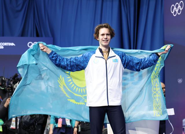 (260214) -- MILAN, Feb. 14, 2026 (Xinhua) -- Mikhail Shaidorov of Kazakhstan celebrates after winning the men's single skating free skating of figure skating event at the Milan-Cortina 2026 Olympic Winter Games in Milan, Italy, Feb. 13, 2026. (Xinhua/Li Ming)