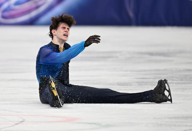 (260214) -- MILAN, Feb. 14, 2026 (Xinhua) -- Mikhail Shaidorov of Kazakhstan reacts after his performance during the men's single skating free skating of figure skating event at the Milan-Cortina 2026 Olympic Winter Games in Milan, Italy, Feb. 13, 2026. (Xinhua/Cheng Min)
