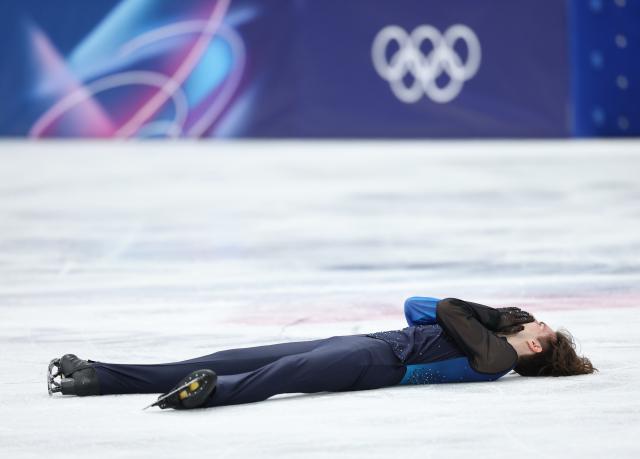 (260214) -- MILAN, Feb. 14, 2026 (Xinhua) -- Mikhail Shaidorov of Kazakhstan reacts after his performance during the men's single skating free skating of figure skating event at the Milan-Cortina 2026 Olympic Winter Games in Milan, Italy, Feb. 13, 2026. (Xinhua/Li Ming)