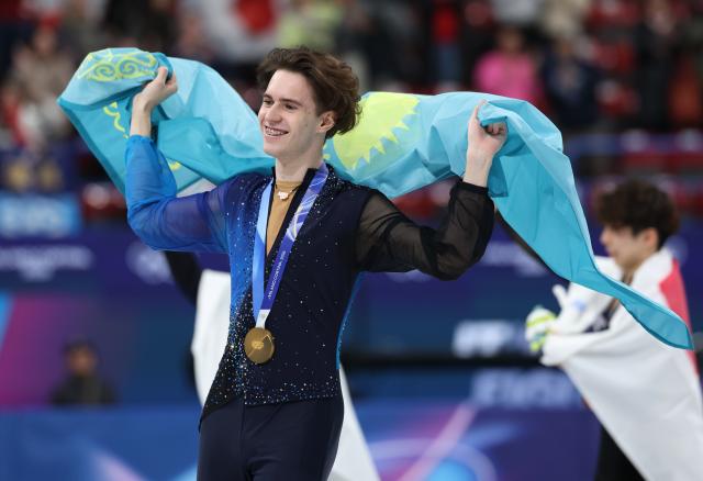 (260214) -- MILAN, Feb. 14, 2026 (Xinhua) -- Mikhail Shaidorov of Kazakhstan celebrates after winning the men's single skating free skating of figure skating event at the Milan-Cortina 2026 Olympic Winter Games in Milan, Italy, Feb. 13, 2026. (Xinhua/Li Ming)