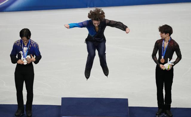 (260214) -- MILAN, Feb. 14, 2026 (Xinhua) -- Gold medalist Mikhail Shaidorov (C) of Kazakhstan celebrates on the podium after the men's single skating free skating of figure skating event at the Milan-Cortina 2026 Olympic Winter Games in Milan, Italy, Feb. 13, 2026. (Xinhua/Xue Yuge)