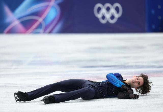 (260214) -- MILAN, Feb. 14, 2026 (Xinhua) -- Mikhail Shaidorov of Kazakhstan reacts after his performance during the men's single skating free skating of figure skating event at the Milan-Cortina 2026 Olympic Winter Games in Milan, Italy, Feb. 13, 2026. (Xinhua/Li Ming)