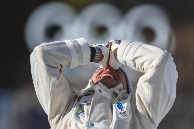 (260214) -- BEIJING, Feb. 14, 2026 (Xinhua) -- Gold medalist Quentin Fillon Maillet of France celebrates during the awarding ceremony of the biathlon men's 10km sprint event at the Milan-Cortina 2026 Olympic Winter Games in Anterselva, Italy, Feb. 13, 2026. (Xinhua/Zhang Tao)