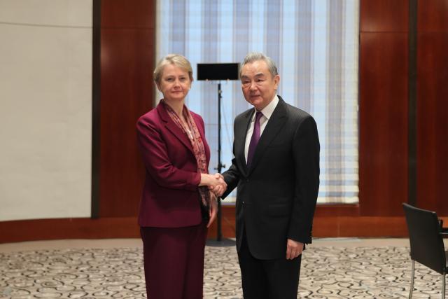 (260213) -- MUNICH, Feb. 13, 2026 (Xinhua) -- Chinese Foreign Minister Wang Yi, also a member of the Political Bureau of the Communist Party of China Central Committee, meets with British Foreign Secretary Yvette Cooper on the sidelines of the Munich Security Conference in Munich, Germany, Feb. 13, 2026. (Xinhua/Du Zheyu)