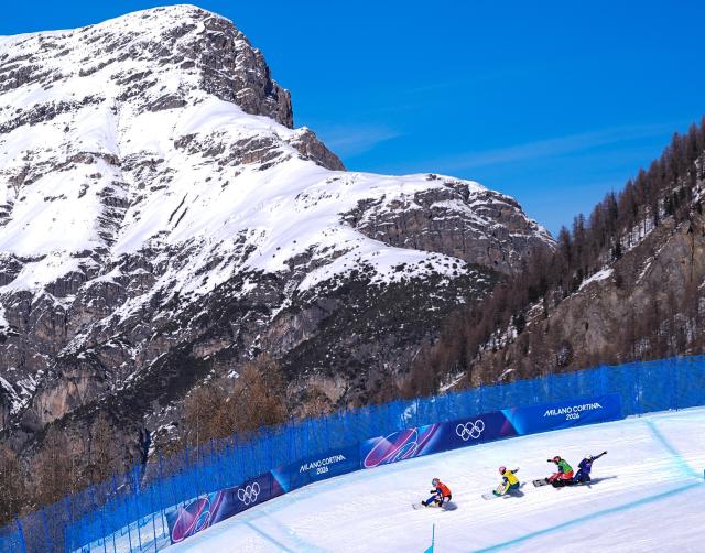 (260214) -- LIVIGNO, Feb. 14, 2026 (Xinhua) -- Eva Adamczykova of the Czech Republic, Josie Baff of Australia, Sina Siegenthaler of Switzerland and Charlotte Bankes of Britain (L to R) compete during the women's snowboard cross quarterfinal at the Milan-Cortina 2026 Olympic Winter Games in Livigno, Italy, Feb. 13, 2026. (Xinhua/Wu Huiwo)