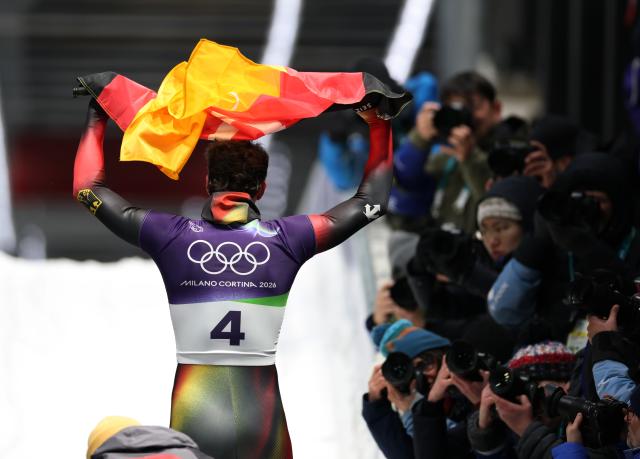 (260214) -- CORTINA D'AMPEZZO, Feb. 14, 2026 (Xinhua) -- Axel Jungk of Germany celebrates after his competition during the skeleton men competition heat 4 at the Milan-Cortina 2026 Olympic Winter Games in Cortina, Italy, Feb. 13, 2026. (Xinhua/Ding Xu)