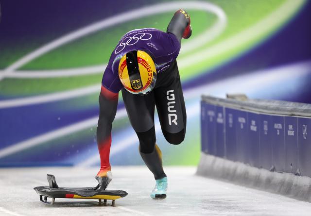 (260214) -- CORTINA D'AMPEZZO, Feb. 14, 2026 (Xinhua) -- Christopher Grotheer of Germany competes during the skeleton men competition heat 3 at the Milan-Cortina 2026 Olympic Winter Games in Cortina, Italy, Feb. 13, 2026. (Xinhua/Ding Xu)
