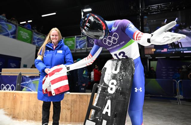 (260214) -- CORTINA D'AMPEZZO, Feb. 14, 2026 (Xinhua) -- Austin Florian of the United States reacts during the skeleton men competition heat 4 at the Milan-Cortina 2026 Olympic Winter Games in Cortina, Italy, Feb. 13, 2026. (Xinhua/Lian Yi)