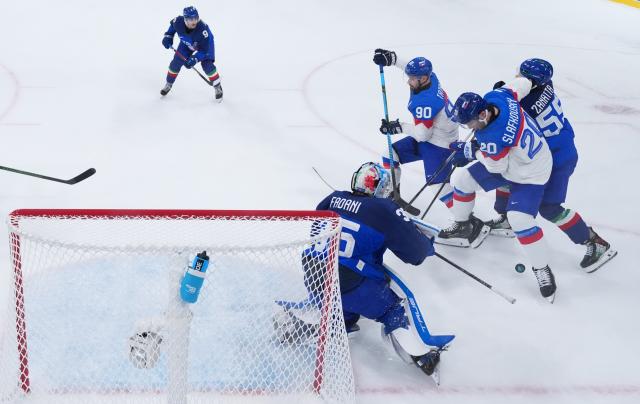 (260214) -- MILAN, Feb. 14, 2026 (Xinhua) -- Players compete during the ice hockey men's preliminary round group B match between Slovakia and Italy of the Milan-Cortina 2026 Olympic Winter Games in Milan, Italy, Feb. 13, 2026. (Wang Kaiyan/Pool via Xinhua)