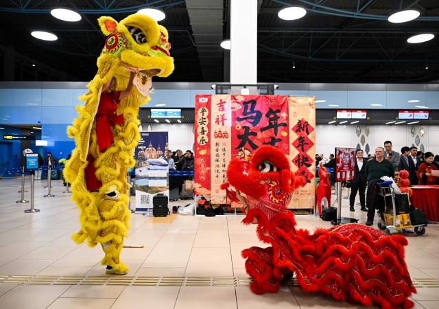 (260214) -- ALMATY, Feb. 14, 2026 (Xinhua) -- A lion dance performance is staged during a Chinese New Year cultural event at the Almaty International Airport in Almaty, Kazakhstan, Feb. 13, 2026. (Xinhua/Li Renzi)