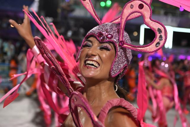 (260214) -- RIO DE JANEIRO, Feb. 14, 2026 (Xinhua) -- A reveller attends a parade during the Carnival 2026 on the Marques De Sapucai Avenue in Rio de Janeiro, Brazil, Feb. 13, 2026. (Photo by Lucio Tavora/Xinhua)