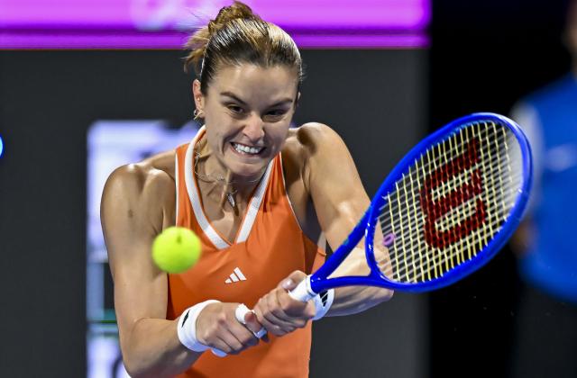 (260214) -- DOHA, Feb. 14, 2026 (Xinhua) -- Maria Sakkari of Greece hits a return during the women's singles semi-final match between Karolina Muchova of the Czech Republic and Maria Sakkari of Greece at the WTA Qatar Open 2026 tennis tournament in Doha, Qatar, on Feb. 13, 2026. (Photo by Nikku/Xinhua)