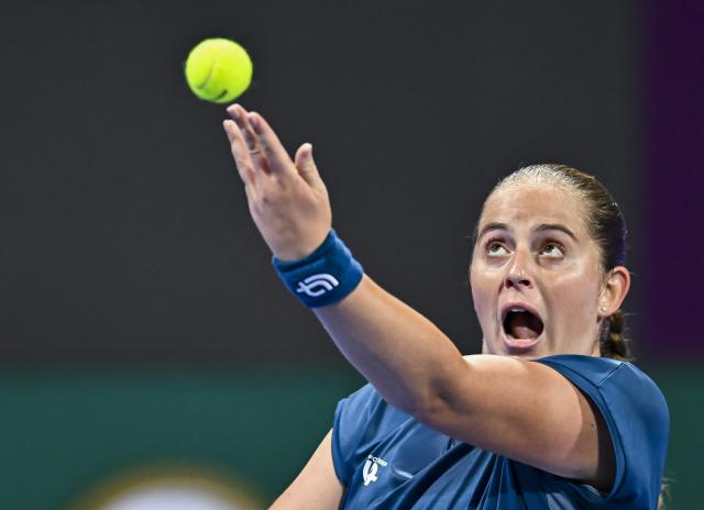 (260214) -- DOHA, Feb. 14, 2026 (Xinhua) -- Jelena Ostapenko of Latvia serves during the women's singles semi-final match between Jelena Ostapenko of Latvia and Victoria Mboko of Canada at the WTA Qatar Open 2026 tennis tournament in Doha, Qatar, on Feb. 13, 2026. (Photo by Nikku/Xinhua)