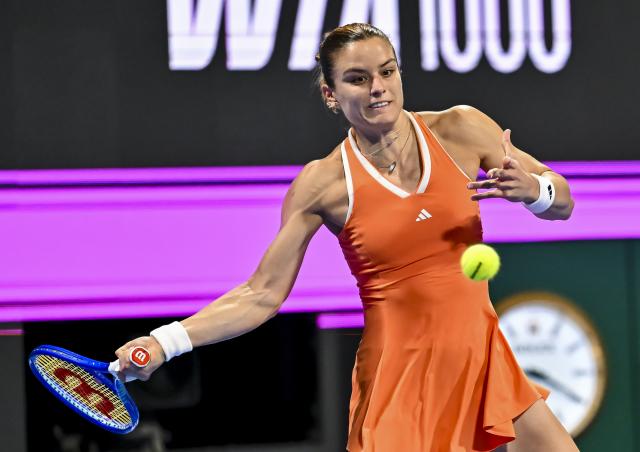 (260214) -- DOHA, Feb. 14, 2026 (Xinhua) -- Maria Sakkari of Greece hits a return during the women's singles semi-final match between Karolina Muchova of the Czech Republic and Maria Sakkari of Greece at the WTA Qatar Open 2026 tennis tournament in Doha, Qatar, on Feb. 13, 2026. (Photo by Nikku/Xinhua)