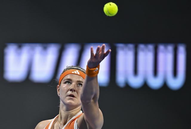 (260214) -- DOHA, Feb. 14, 2026 (Xinhua) -- Karolina Muchova of the Czech Republic serves during the women's singles semi-final match between Karolina Muchova of the Czech Republic and Maria Sakkari of Greece at the WTA Qatar Open 2026 tennis tournament in Doha, Qatar, on Feb. 13, 2026. (Photo by Nikku/Xinhua)