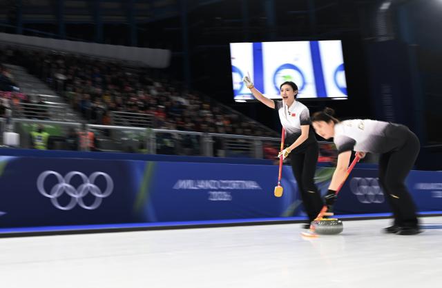 (260214) -- CORTINA D'AMPEZZO, Feb. 14, 2026 (Xinhua) -- Jiang Jiayi (L) and Dong Ziqi of China competes during the curling women round robin session 4 match between China and Italy at the 2026 Milan-Cortina Winter Olympics in Cortina, Italy, Feb. 14, 2026. (Xinhua/Lian Yi)