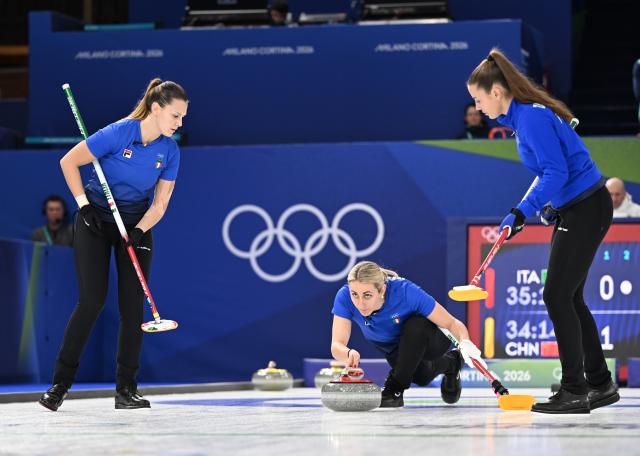 (260214) -- CORTINA D'AMPEZZO, Feb. 14, 2026 (Xinhua) -- Elena Mathis (C) of Italy competes during the curling women round robin session 4 match between China and Italy at the 2026 Milan-Cortina Winter Olympics in Cortina, Italy, Feb. 14, 2026. (Xinhua/Lian Yi)