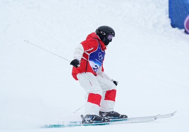 (260214) -- LIVIGNO, Feb. 14, 2026 (Xinhua) -- Li Ruilin of China reacts after crossing the finish line during the freestyle skiing women's dual moguls 1/16 finals at the Milan-Cortina 2026 Olympic Winter Games in Livigno, Italy, Feb. 14, 2026. (Xinhua/Wu Huiwo)