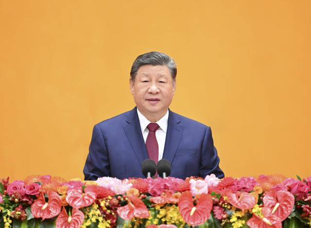 (260214) -- BEIJING, Feb. 14, 2026 (Xinhua) -- Chinese President Xi Jinping, also general secretary of the Communist Party of China (CPC) Central Committee and chairman of the Central Military Commission, delivers a speech at a reception to usher in the Chinese New Year at the Great Hall of the People in Beijing, capital of China, Feb. 14, 2026. The CPC Central Committee and the State Council held the reception here on Saturday. (Xinhua/Li Xiang)