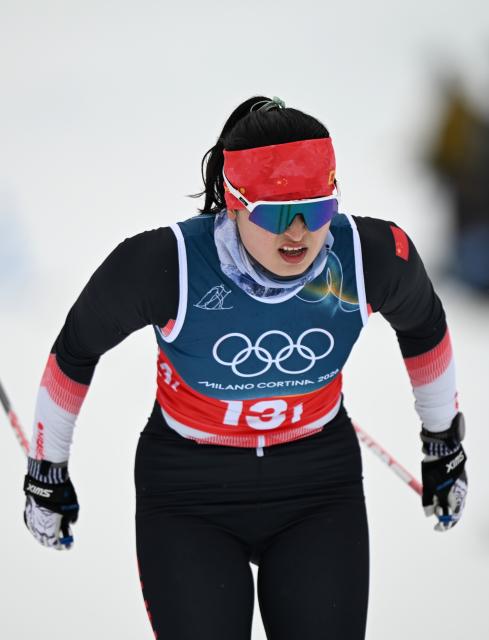 (260214) -- TESERO, Feb. 14, 2026 (Xinhua) -- China's Dinigeer Yilamujiang competes during the cross-country skiing women's 4x7.5km relay match at the Milan-Cortina 2026 Olympic Winter Games in Tesero, Italy, Feb. 14, 2026. (Xinhua/He Canling)