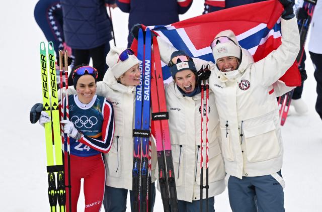 (260214) -- TESERO, Feb. 14, 2026 (Xinhua) -- Athletes of Norway celebrate after the cross-country skiing women's 4x7.5km relay match at the Milan-Cortina 2026 Olympic Winter Games in Tesero, Italy, Feb. 14, 2026. (Xinhua/He Canling)