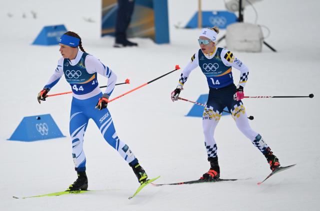 (260214) -- TESERO, Feb. 14, 2026 (Xinhua) -- Athletes compete during the cross-country skiing women's 4x7.5km relay match at the Milan-Cortina 2026 Olympic Winter Games in Tesero, Italy, Feb. 14, 2026. (Xinhua/He Canling)