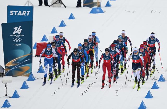 (260214) -- TESERO, Feb. 14, 2026 (Xinhua) -- Athletes start during the cross-country skiing women's 4x7.5km relay match at the Milan-Cortina 2026 Olympic Winter Games in Tesero, Italy, Feb. 14, 2026. (Xinhua/He Canling)