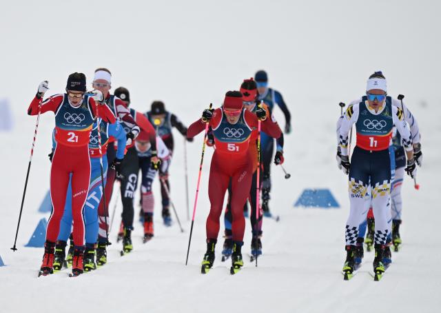 (260214) -- TESERO, Feb. 14, 2026 (Xinhua) -- Athletes compete during the cross-country skiing women's 4x7.5km relay match at the Milan-Cortina 2026 Olympic Winter Games in Tesero, Italy, Feb. 14, 2026. (Xinhua/He Canling)
