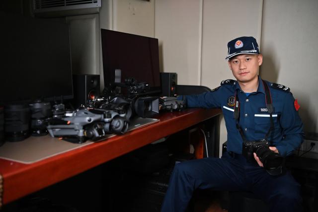 (260214) -- SOUTH CHINA SEA, Feb. 14, 2026 (Xinhua) -- Law enforcer Qiu Canhui is pictured at a workshop aboard the China Coast Guard (CCG) vessel Wanshan in the territorial waters of China's Huangyan Dao, Feb. 11, 2026. Right ahead of the Chinese New Year, a traditional occasion for family reunion in China, a group of young law enforcers remain loyally stationed and highly alert around the clock, hundreds of miles away from their loved ones. (Photo by Zhai Yifan/Xinhua)