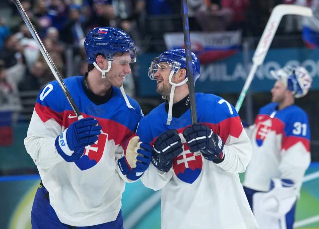 (260214) -- MILAN, Feb. 14, 2026 (Xinhua) -- Juraj Slafkovsky (L) and Libor Hudacek of Slovakia react during the ice hockey men's preliminary round group B match between Sweden and Slovakia of the Milan-Cortina 2026 Olympic Winter Games in Milan, Italy, Feb. 14, 2026. (Xinhua/Tao Xiyi)