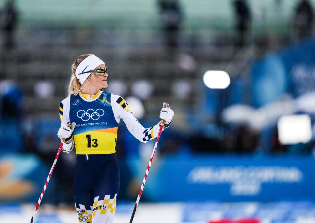 (260214) -- TESERO, Feb. 14, 2026 (Xinhua) -- Frida Karlsson of Sweden reacts during the cross-country skiing women's 4x7.5km relay match at the Milan-Cortina 2026 Olympic Winter Games in Tesero, Italy, Feb. 14, 2026. (Xinhua/Peng Ziyang)