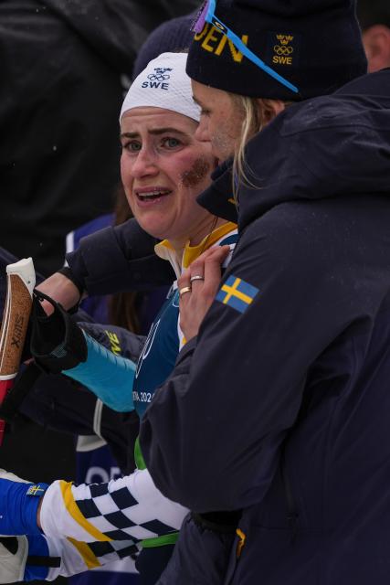 (260214) -- TESERO, Feb. 14, 2026 (Xinhua) -- Ebba Andersson of Sweden reacts after the cross-country skiing women's 4x7.5km relay match at the Milan-Cortina 2026 Olympic Winter Games in Tesero, Italy, Feb. 14, 2026. (Xinhua/Peng Ziyang)