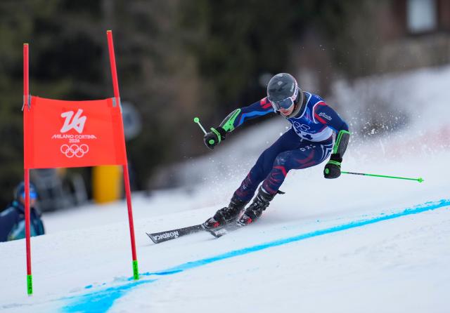(260214) -- BORMIO, Feb. 14, 2026 (Xinhua) -- Yung Hau Tsuen Adrian of China's Hong Kong competes during the alpine skiing men's giant slalom run 2 at the Milan-Cortina 2026 Olympic Winter Games in Bormio, Italy, Feb. 14, 2026. (Xinhua/Hu Huhu)