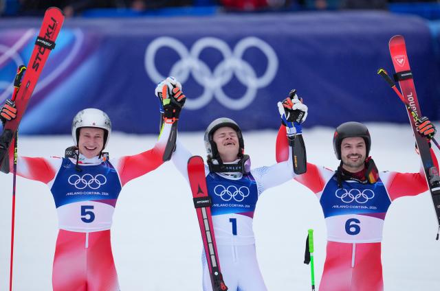 (260214) -- BORMIO, Feb. 14, 2026 (Xinhua) -- Gold medalist Lucas Pinheiro Braathen (C) of Brazil, silver medalist Marco Odermatt (L) of Switzerland, and bronze medalist Loic Meillard of Switzerland celebrate after the alpine skiing men's giant slalom run 2 at the Milan-Cortina 2026 Olympic Winter Games in Bormio, Italy, Feb. 14, 2026. (Xinhua/Hu Huhu)