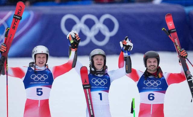 (260214) -- BORMIO, Feb. 14, 2026 (Xinhua) -- Gold medalist Lucas Pinheiro Braathen (C) of Brazil, silver medalist Marco Odermatt (L) of Switzerland, and bronze medalist Loic Meillard of Switzerland celebrate after the alpine skiing men's giant slalom run 2 at the Milan-Cortina 2026 Olympic Winter Games in Bormio, Italy, Feb. 14, 2026. (Xinhua/Hu Huhu)