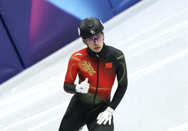 (260214) -- MILAN, Feb. 14, 2026 (Xinhua) -- Liu Shaoang of China reacts after the short track speed skating men's 1500m quarterfinal at the Milan-Cortina 2026 Olympic Winter Games in Milan, Italy, Feb. 14, 2026. (Xinhua/Li Ming)