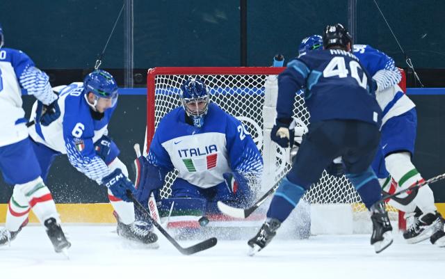 (260214) -- MILAN, Feb. 14, 2026 (Xinhua) -- Jason Seed (1st L) of Italy competes during the ice hockey men's preliminary round group B match between Finland and Italy at the Milan-Cortina 2026 Olympic Winter Games in Milan, Italy, Feb. 14, 2026. (Xinhua/Zhang Haofu)